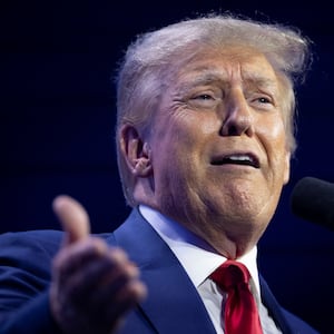 Former U.S. President and Republican presidential candidate Donald Trump gestures as he speaks during the Turning Point Action Conference in West Palm Beach, Florida