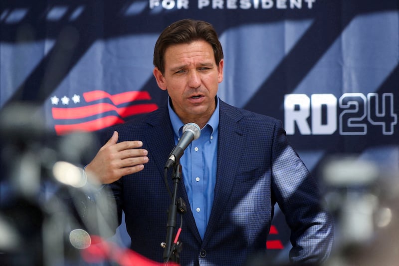 Florida Governor and Republican U.S. presidential candidate Ron DeSantis attends a barbecue hosted by former diplomat Scott Brown