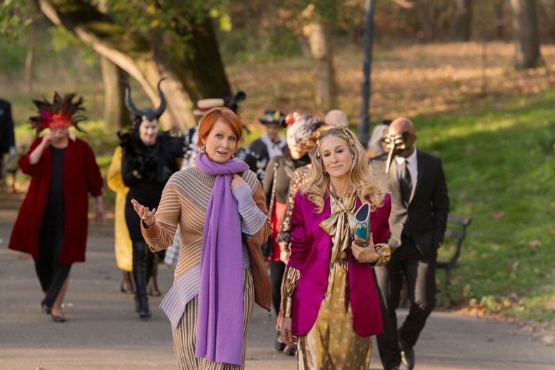 A still of Cynthia Nixon as Miranda and Sarah Jessica Parker as Carrie in And Just Like That. 