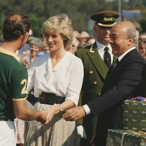 Princess Diana and Mohamed al-Fayed present a prize to Prince Charles at a polo competition in 1987