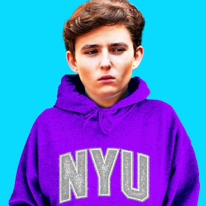 Barron Trump in a NYU sweatshirt