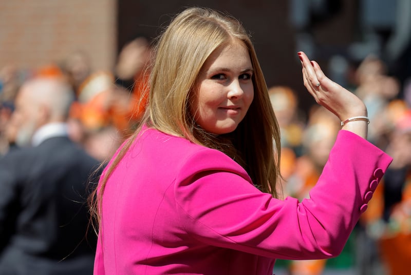 Princess Catharina-Amalia smiles and waves during an event