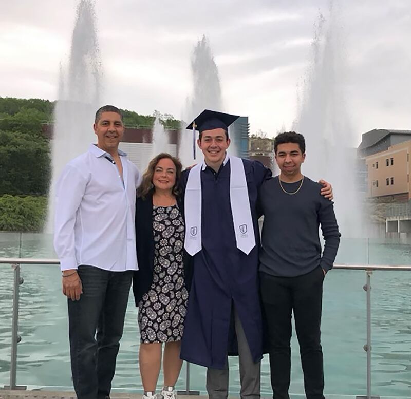 Ali Louis Bourzgui’s college graduation, featuring, l to r, Abdelali Bourzgui, Rita Giovanetti, Ali, and Driss Bourzgui