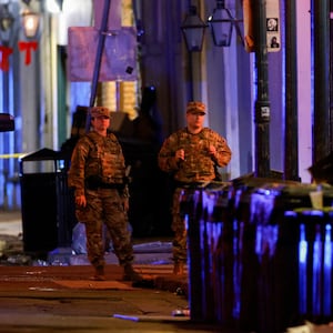 Military personnel stand near the scene where a vehicle drove into a crowd during New Year's celebrations, in New Orleans, Louisiana, U.S., January 1, 2025.